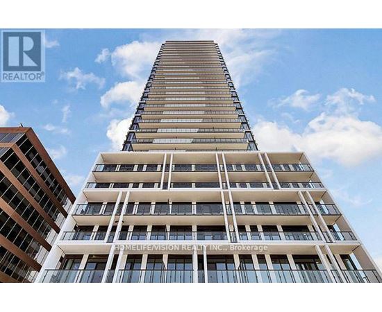 A tall building with a sign that reads "REALTOR" on the top left corner.
