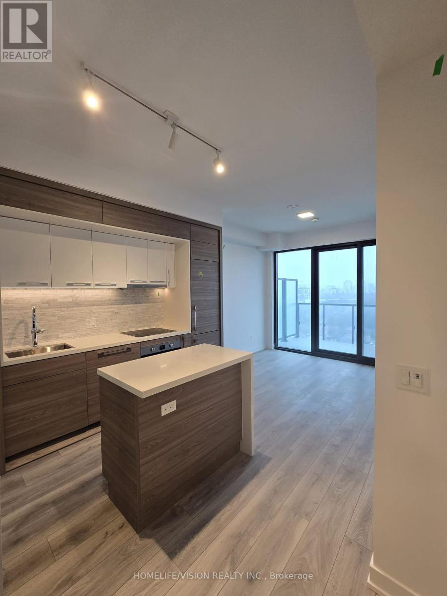 A modern kitchen with wooden cabinets and a white island.