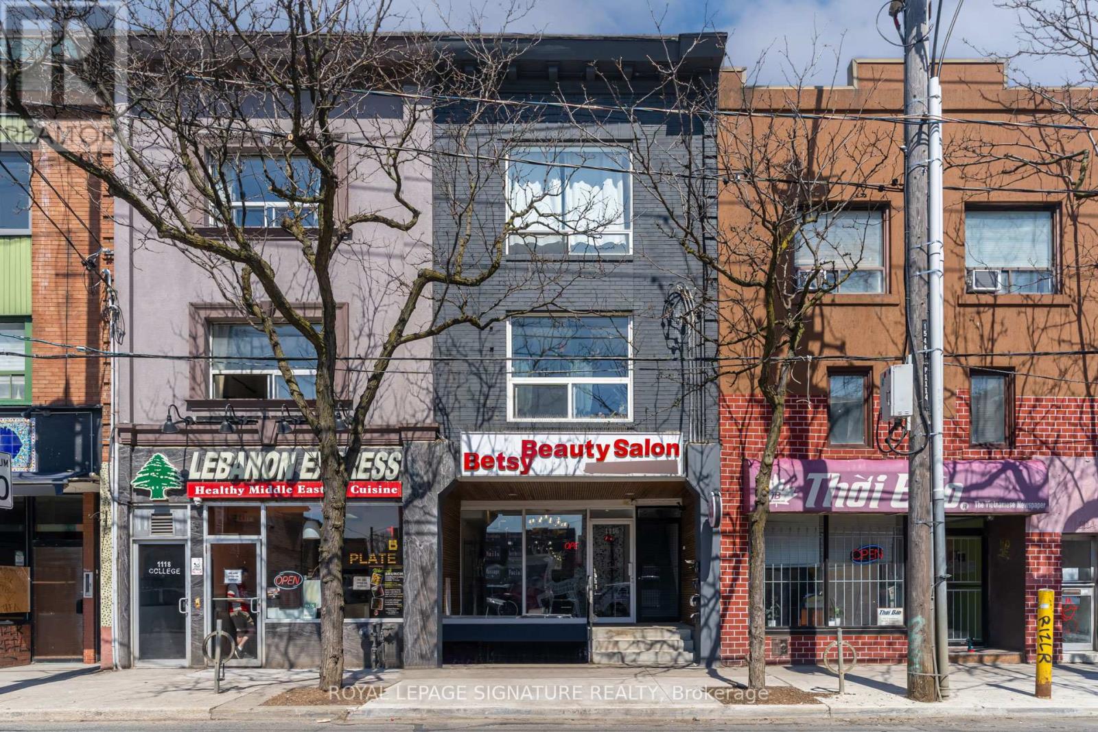 A street view of a building with a sign that says "Beauty Salon".