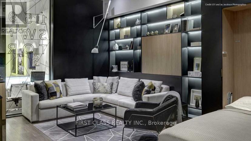 A modern living room with a black and white color scheme.