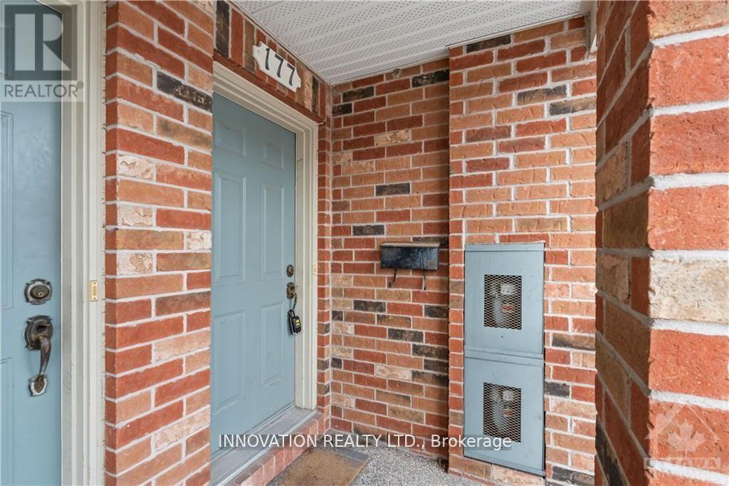 A blue door is on the left and a grey box is on the right.