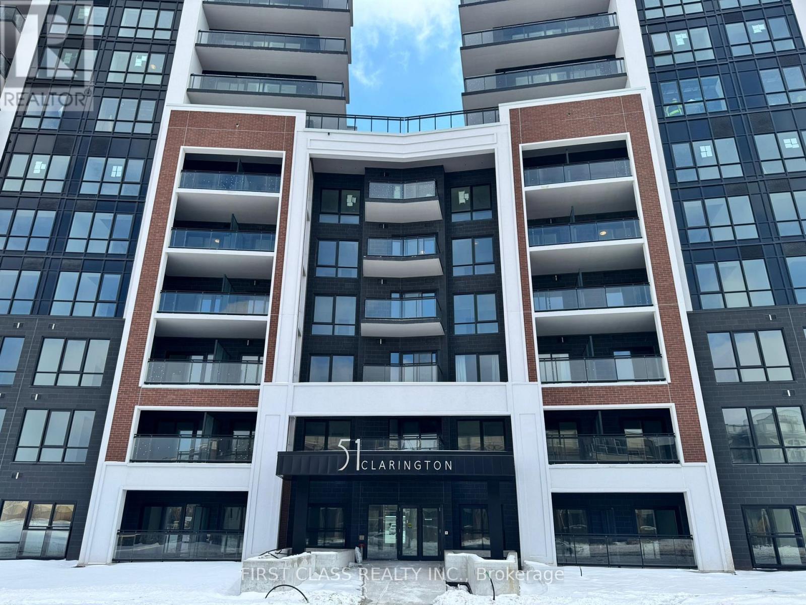 The Clarington building is a modern apartment complex with a black and white facade.
