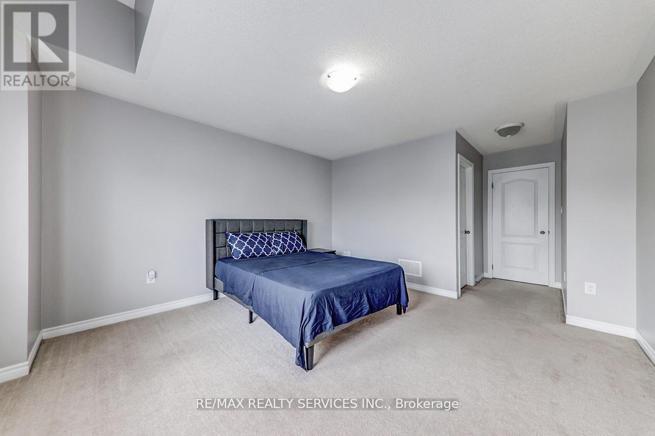 A bedroom with a bed and a door.