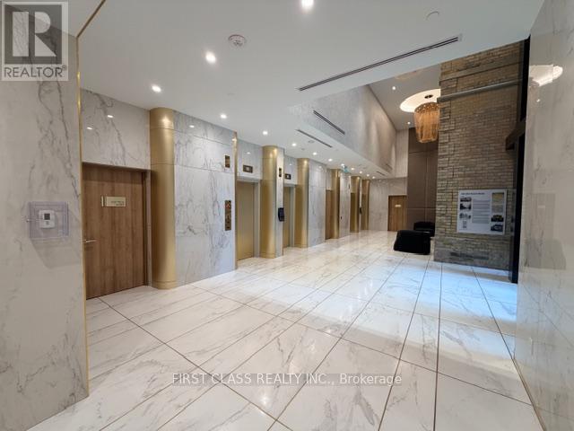 A hallway with marble floors and wooden doors.