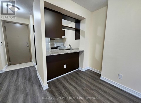 A kitchen area with a sink and a countertop.