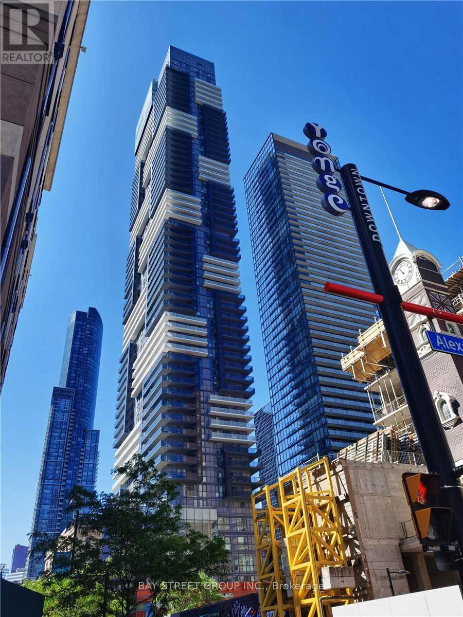 A tall building with the word "Cosmopolitan" on it is in the background.