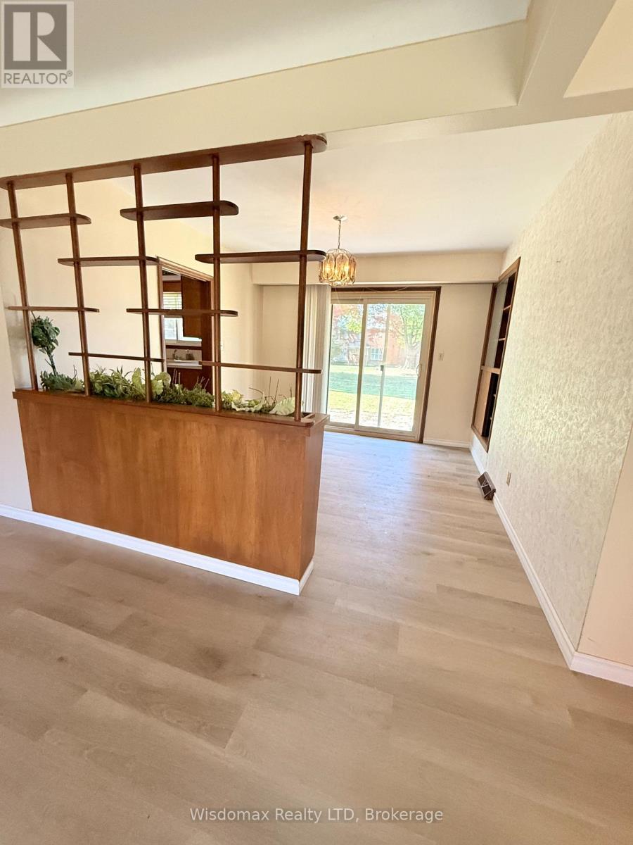 A room with a wooden planter on the wall.