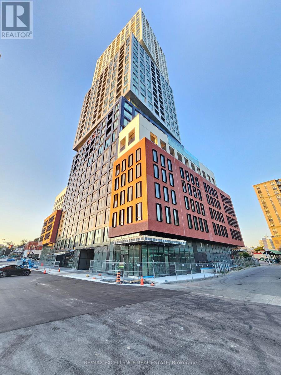 A tall building with a glass facade is under construction.
