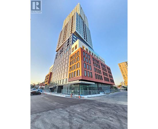 A tall building with a glass facade is under construction.
