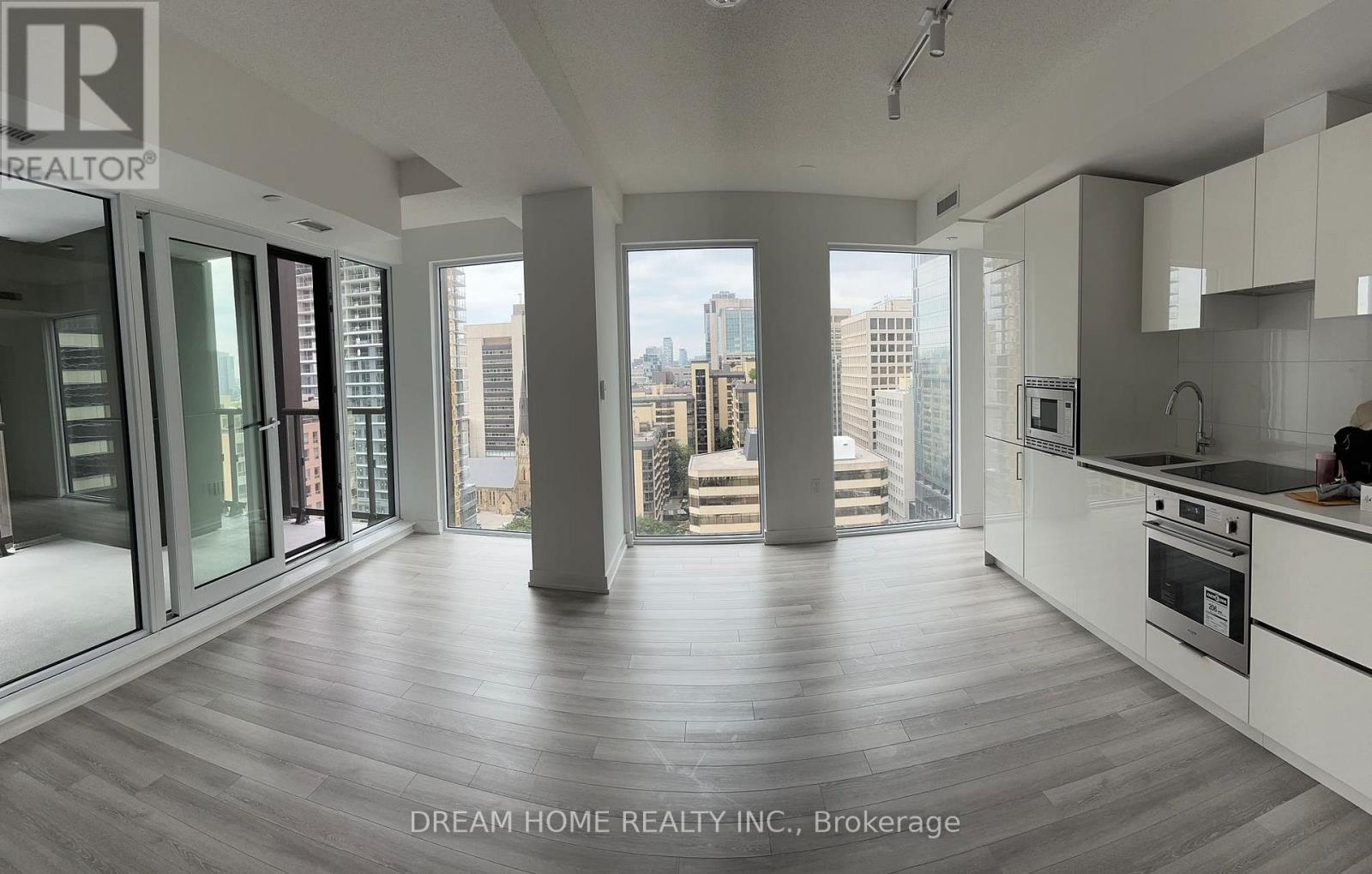 A modern kitchen with a view of the city.