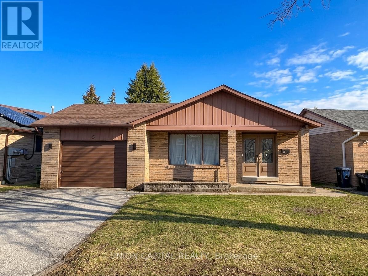 A house with a brown roof and a brown garage door is for sale.