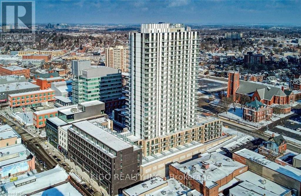 A cityscape with a large building in the center and smaller buildings surrounding it.