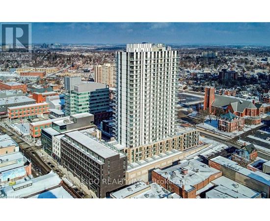 A cityscape with a large building in the center and smaller buildings surrounding it.