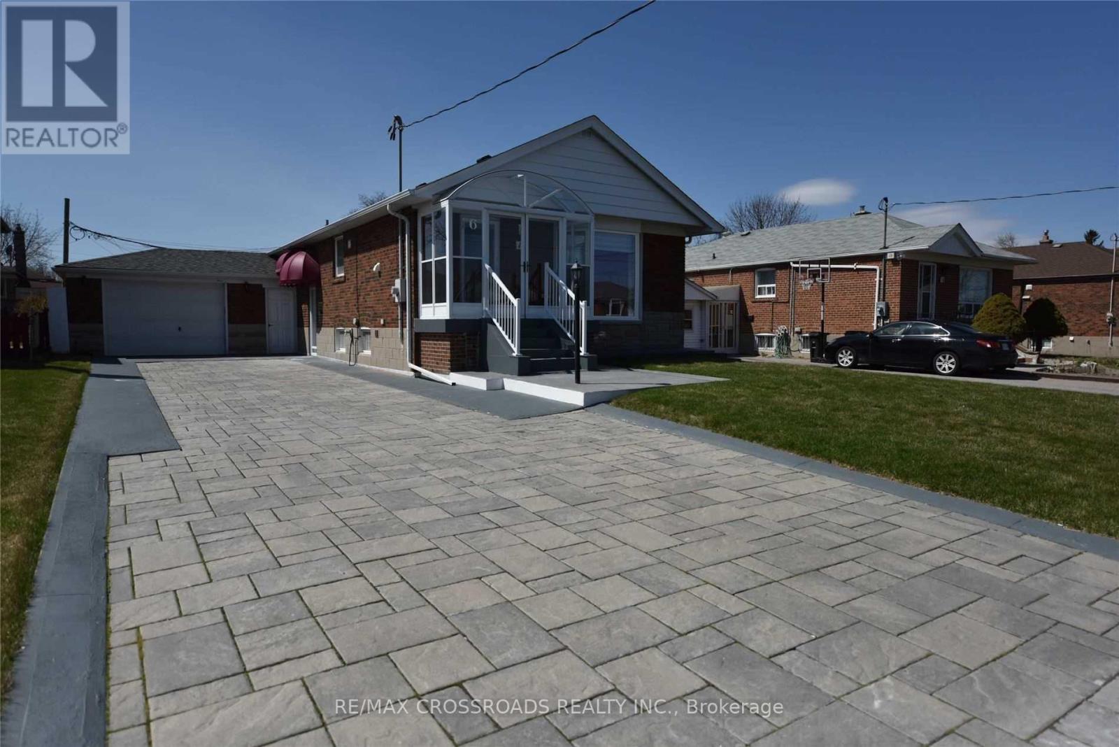 A house with a driveway in front of it.