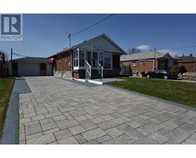 A house with a driveway in front of it.