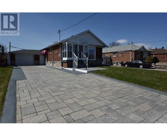 A house with a driveway in front of it.