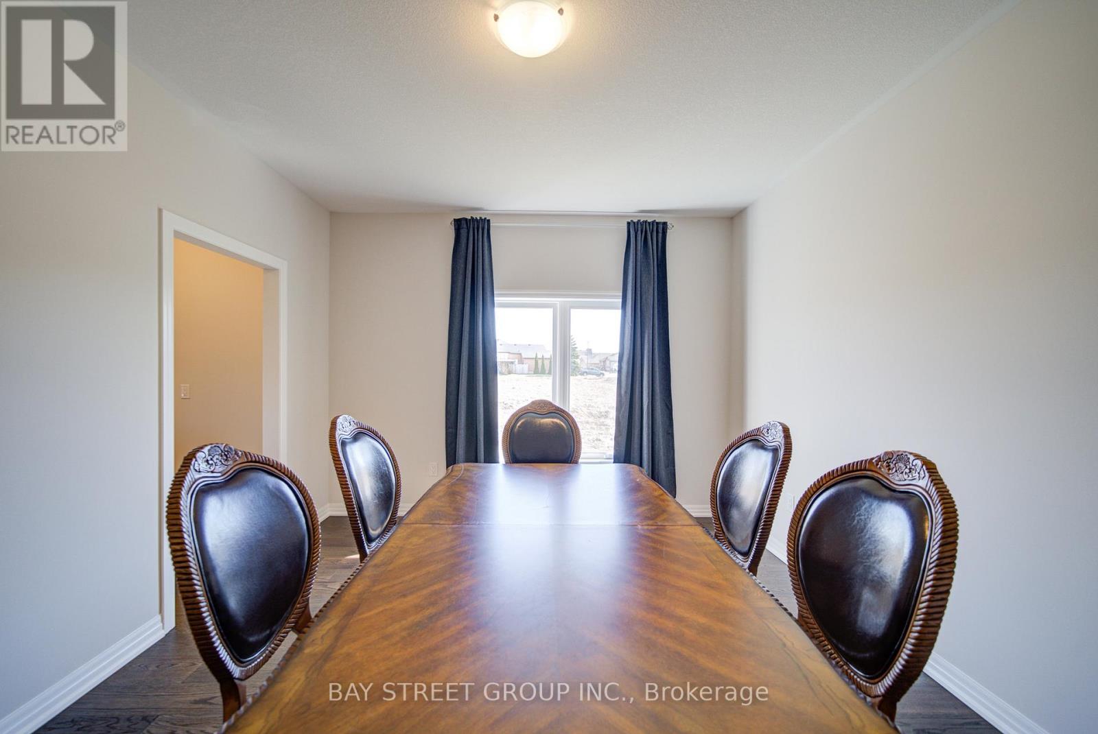 A conference room with a long table and chairs.