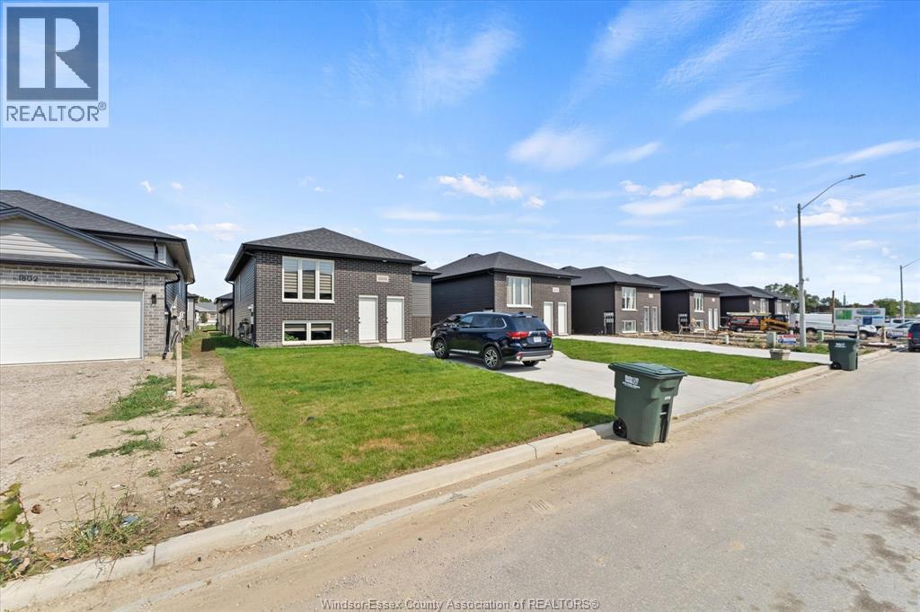 A row of houses with a REALTOR® logo in the corner.