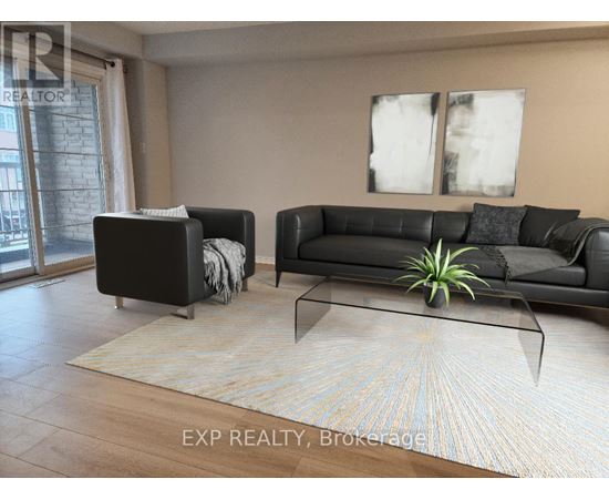 A living room with a black couch, a white couch, and a rug.