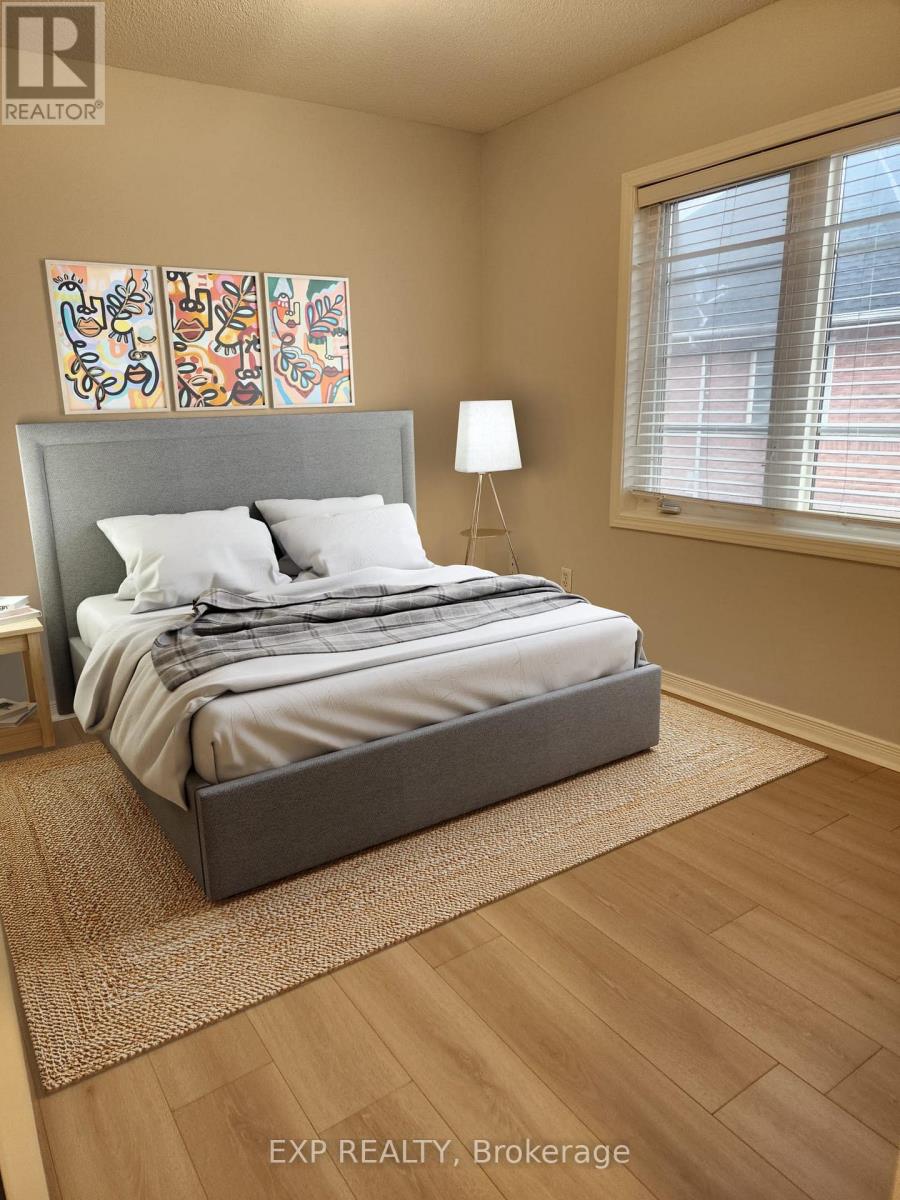 A bedroom with a large bed and a painting on the wall.
