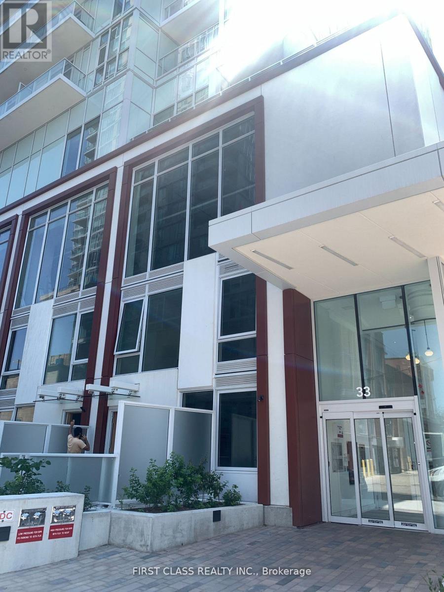 The building is white and red with a glass door.