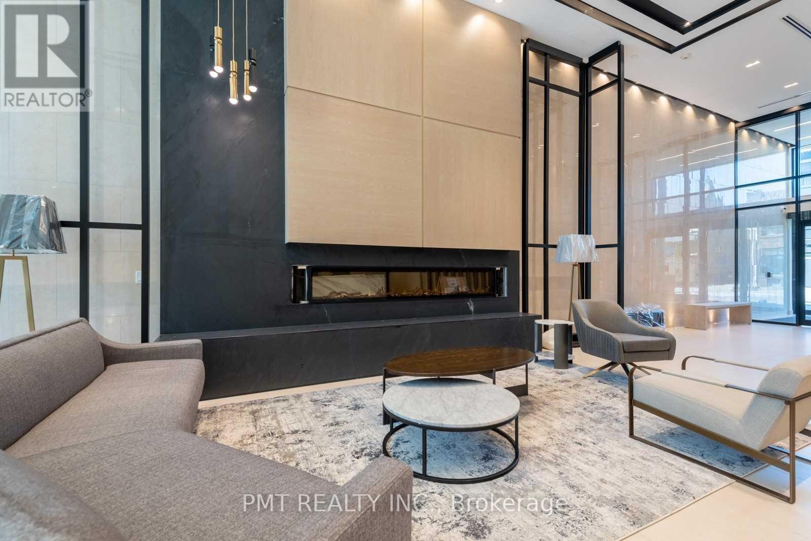 A modern living room with a fireplace and a couch.