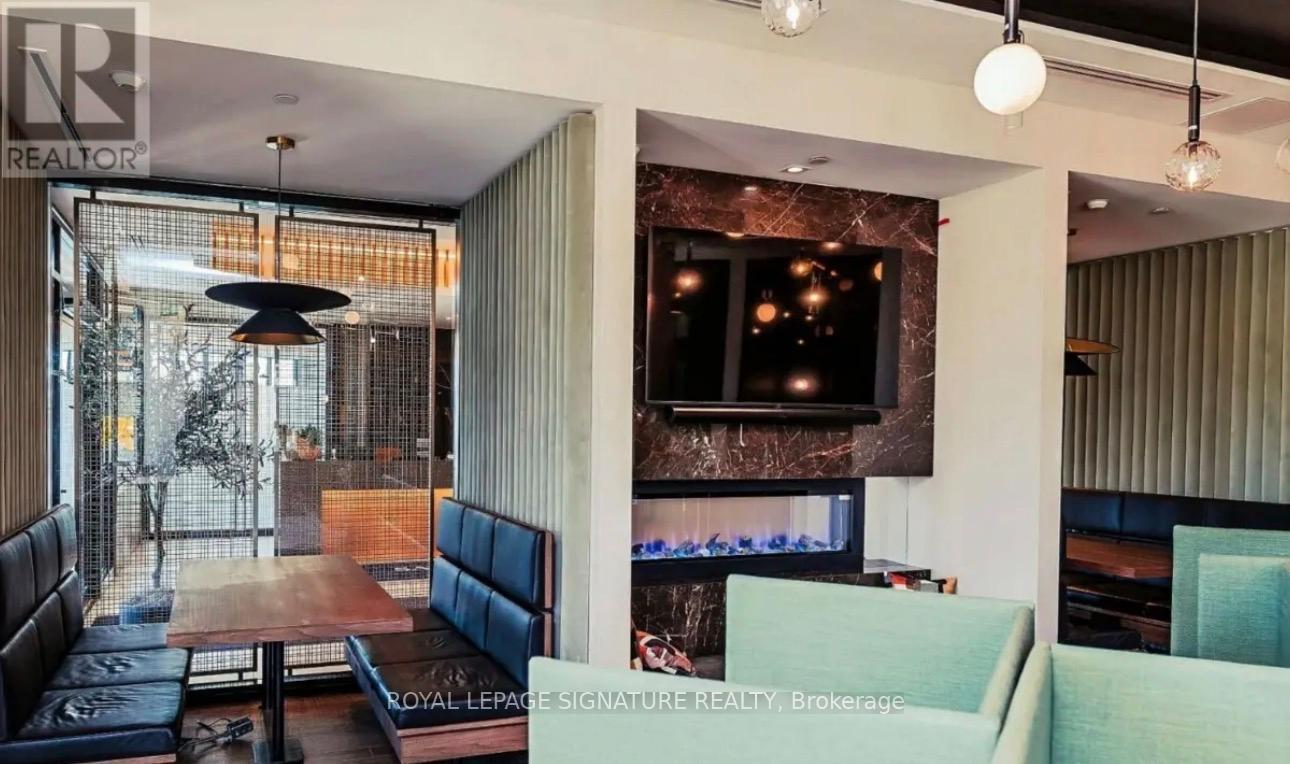 A modern living room with a television and a fireplace.
