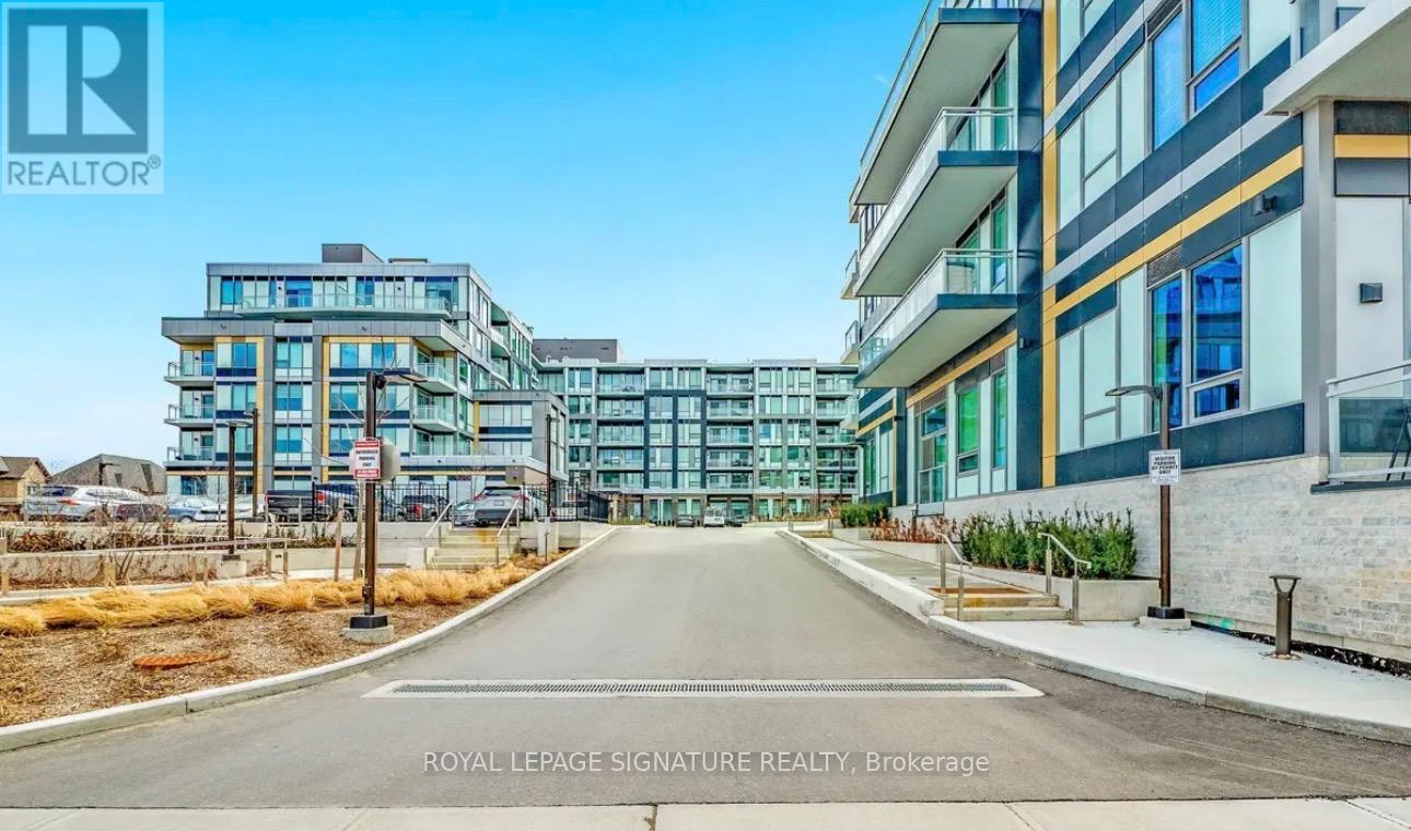 A street view of a residential area with apartment buildings and a sign for Royal LePage Signature Realty.