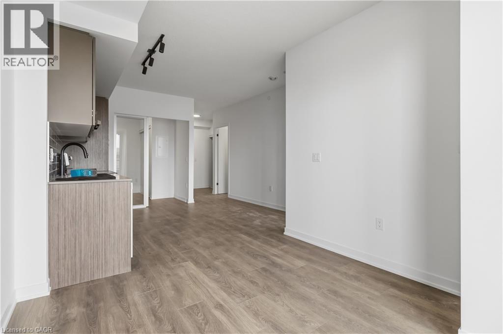 A spacious room with a cabinet and a door in the background.