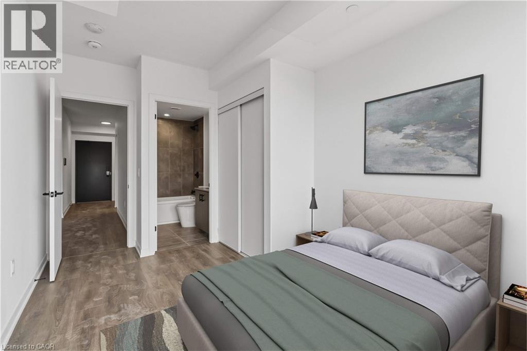 A bedroom with a large bed and a painting on the wall.