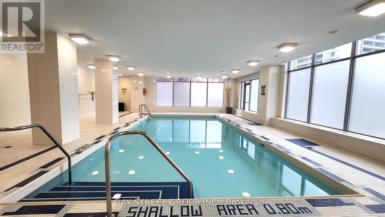 A swimming pool with the words "Shallow Area 0.80m" written on the floor.