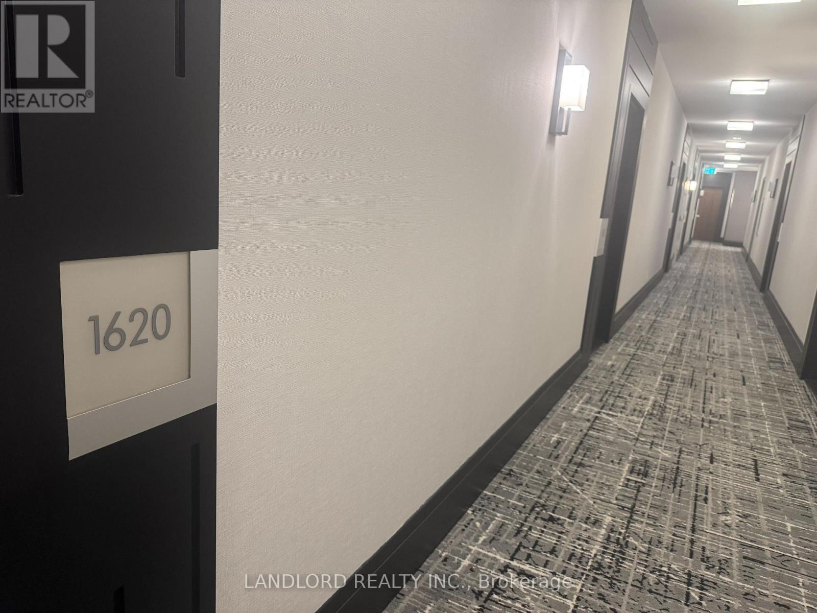 A hallway with a sign that says 1620 on it.