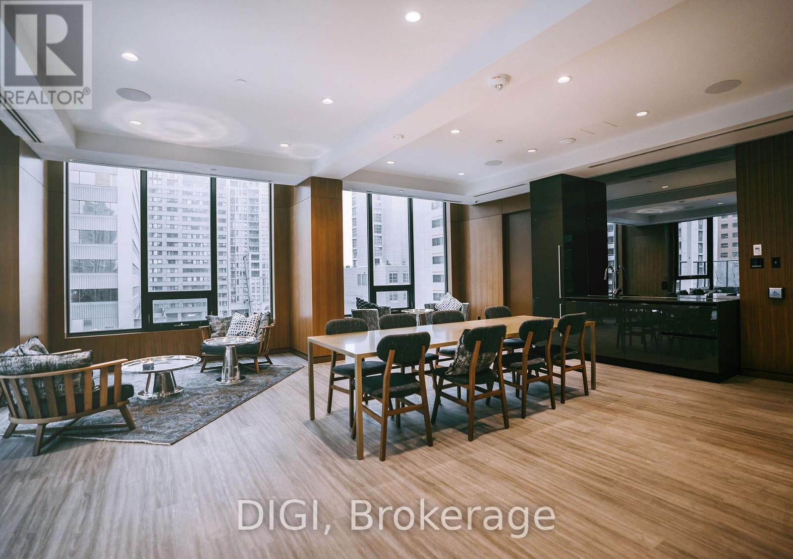 A modern dining room with a view of the city.