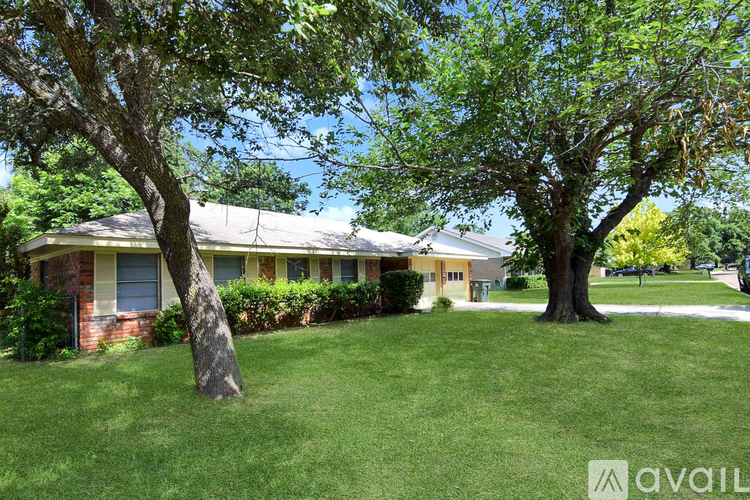 A house with a tree in front of it.