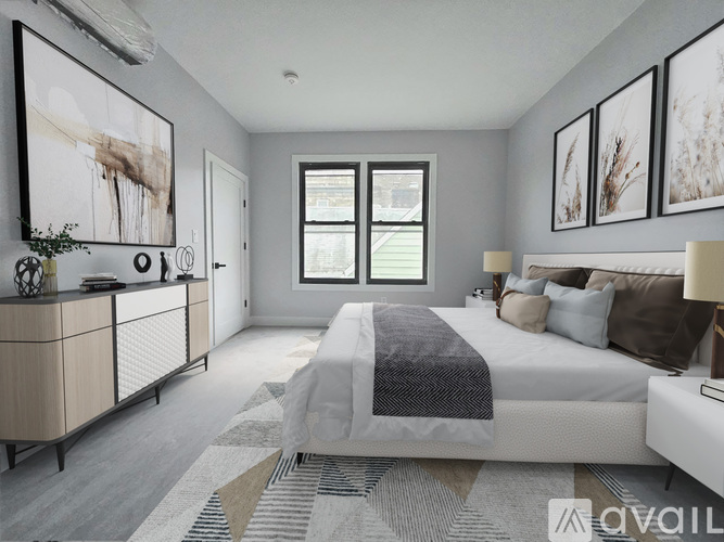 A bedroom with a large bed, a dresser, and a window.