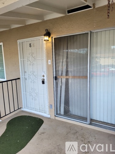 A white door with a glass window is closed.