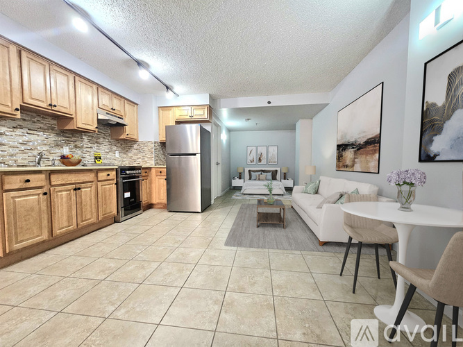 A kitchen with wooden cabinets and a tiled floor.