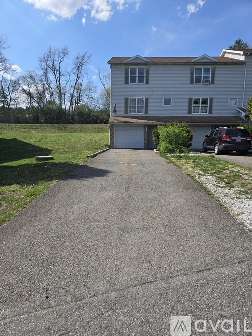 A house with a driveway in front of it.