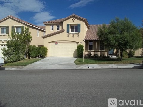 A house with a garage is available for sale.