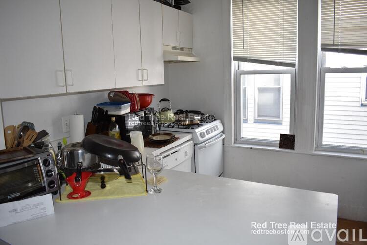 A kitchen with a stove top oven and a microwave.