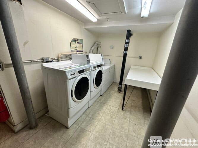 A laundry room with a washer and dryer.
