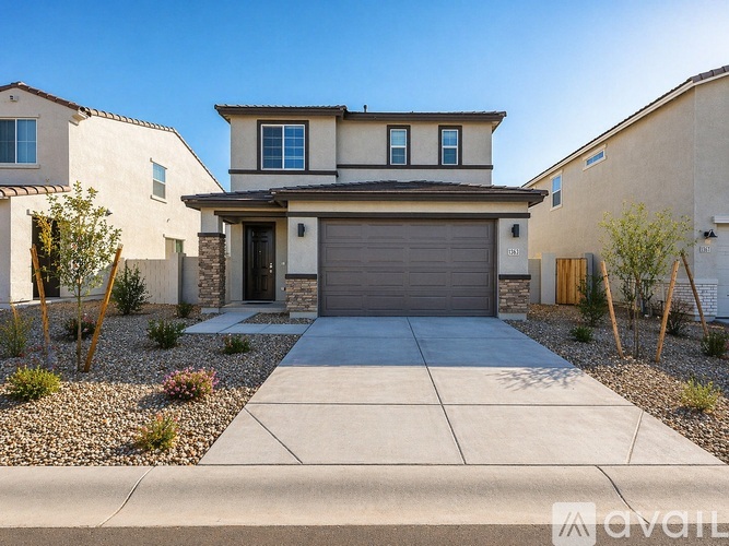 A modern house with a garage door in the center.