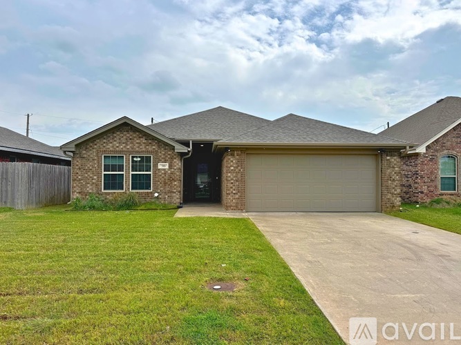 A house with a garage door is for sale.