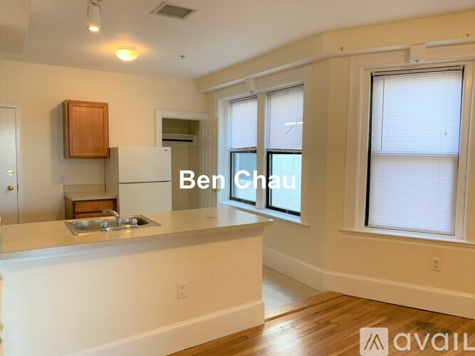 A kitchen with a sink and a window.