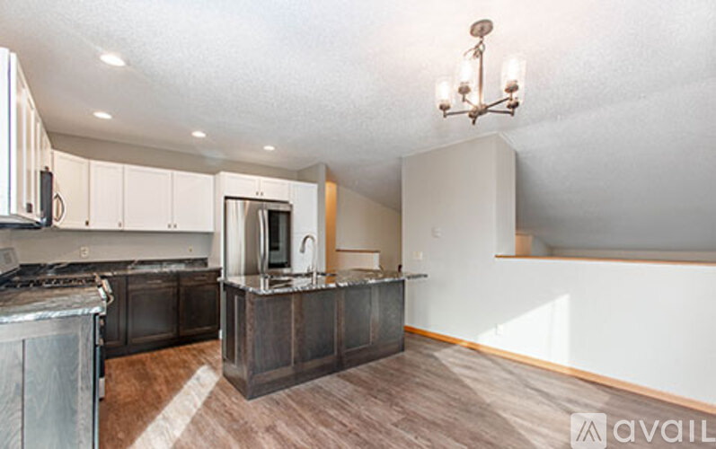 A kitchen with a stove top oven and a microwave.