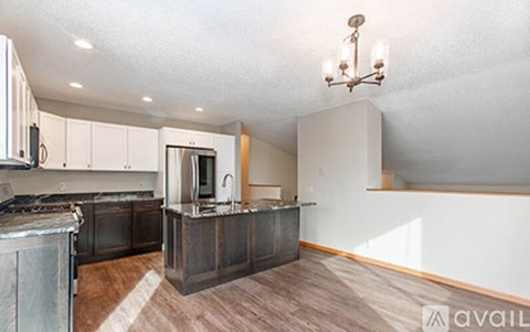 A kitchen with a stove top oven and a microwave.
