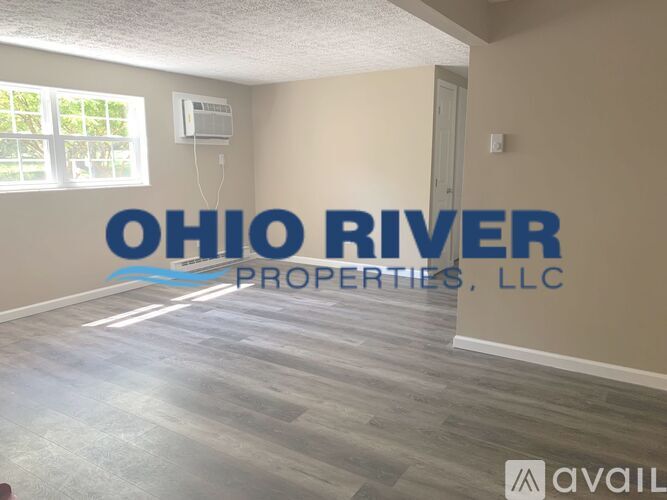 A room with a sign that says Ohio River Properties, LLC.