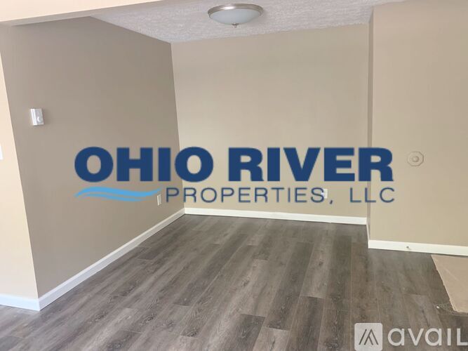 A room with a logo that says "Ohio River Properties, LLC" on the wall.