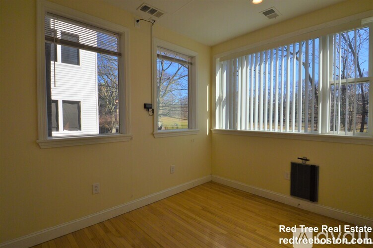 A room with a window and a door.