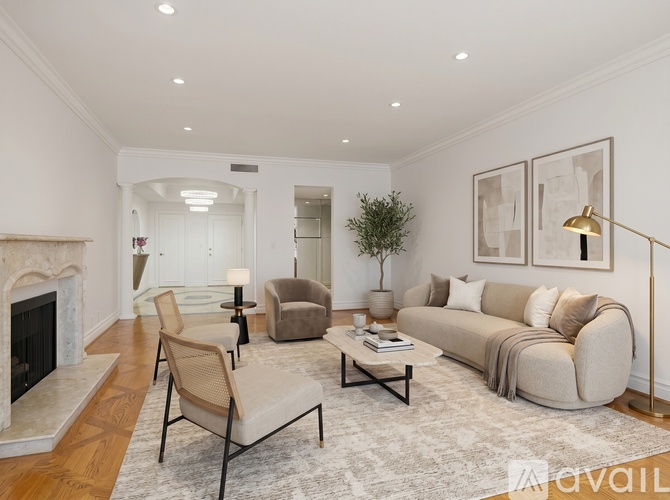 A living room with a fireplace and a couch.